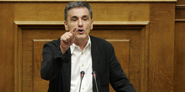 ATHENS, GREECE - JULY 22: Greek Finance Minister Euclid Tsakalotos addresses lawmakers during a parliamentary session on July 22, 2015 in Athens, Greece. Greece's leftist government tried on Wednesday to contain a rebellion in Prime Minister Alexis Tsipras' Syriza party ahead of a vote in the evening on reforms required to start talks on a rescue deal. (Photo by Milos Bicanski/Getty Images)