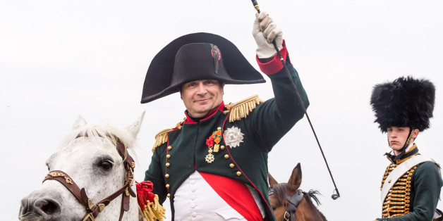 A re-enactor playing the role of the Napoleon Bonaparte rides his horse during the reconstruction of "The Allied Counterattack" as part of the commemoration of the bicentenary of the battle of Waterloo in Braine-l'Alleud, near Waterloo, Belgium on Saturday, June 20, 2015. Over two days, 5000 re-enactors, 300 horses and 100 canons reconstruct two phases of the battle of Waterloo. (AP Photo/Geert Vanden Wijngaert)