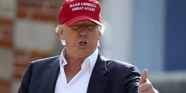 Presidential contender Donald Trump, speaks to the media after arriving by helicopter during the 1st first day of the Women's British Open golf championship on the Turnberry golf course in Turnberry, Scotland, Thursday, July 30, 2015. (AP Photo/Scott Heppell)