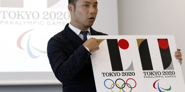 Japanese designer Kenjiro Sano gives a detailed explanation of how he came up with his logo for the 2020 Tokyo Olympics at a press conference in Tokyo, Wednesday, Aug. 5, 2015. Sano refuted claims Wednesday that he copied the emblem of a Belgian theater when he created the official logo for the 2020 Tokyo Olympics. Belgian designer Olivier Debie has asked the International Olympic Committee and Tokyo Olympic organizers to change the logo because it bears too much resemblance to his emblem for t