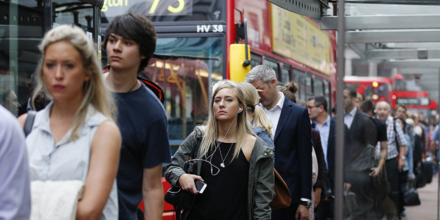 People queue up for bus transport at Victoria Station in London, Thursday, Aug. 6, 2015. A 24-hour strike of London tube workers continues over pay and conditions surrounding the planned introduction of overnight tube services. The Underground handles 4 million journeys a day, and the strike by members of four unions will likely paralyze the capital's transport system, despite extra bus and river services. (AP Photo/Frank Augstein)