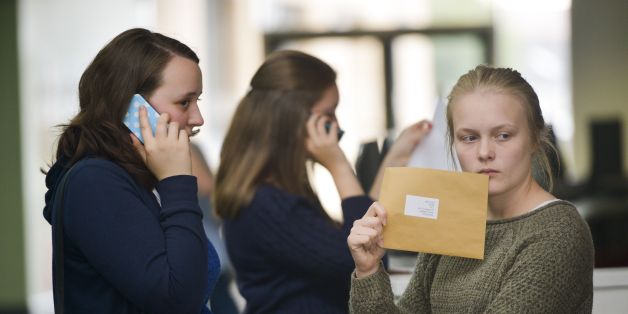 Students at Yate International Academy, South Gloucestershire, open their A-Level exam results, as official figures show that more A-levels were handed the very highest grade this summer, but the overall pass rate fell for the first time in more than 30 years.