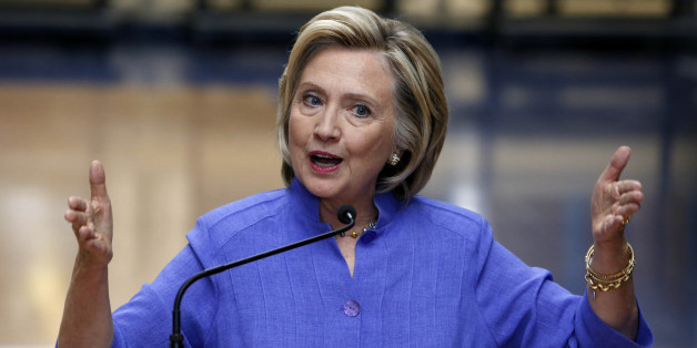 Democratic presidential candidate Hillary Rodham Clinton answers reporters questions about Republican presidential candidate Donald Trump after announcing her college affordability plan, Monday, Aug. 10, 2015, at the high school in Exeter, N.H. (AP Photo/Jim Cole)