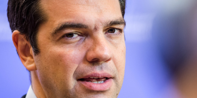 Greek Prime Minister Alexis Tsipras speaks with the media after a meeting of eurozone heads of state at the EU Council building in Brussels on Monday, July 13, 2015. A summit of eurozone leaders reached a tentative agreement with Greece on Monday for a bailout program that includes "serious reforms" and aid, removing an immediate threat that Greece could collapse financially and leave the euro. (AP Photo/Geert Vanden Wijngaert)