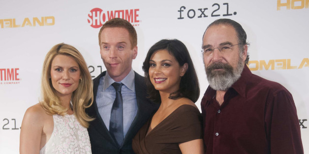 Cast members, from left, Claire Danes, Damian Lewis, Morena Baccarin, and Mandy Patinkin arrive at the private premiere screening for the 3rd Season of "Homeland" at Corcoran Gallery of Art on Monday, Sept. 9, 2013 in Washington. (Photo by Kevin Wolf/Invision/AP)