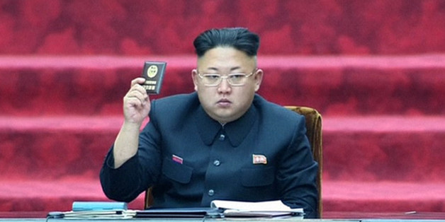 In this Wednesday, April 9, 2014 image made from video, North Korean leader Kim Jong Un holds up a parliament membership certificate during the Supreme People's Assembly in Pyongyang, North Korea. North Korea is declaring that the upcoming release of "The Interview," a comedy film about a plot to assassinate Kim Jong Un, would be an act of war. From over-the-top villainous roles in films such as "Olympus Has Fallen" and "Die Another Day" to madcap impersonations in series like "30 Rock" and "MAD