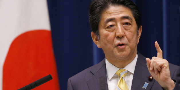 Japan's Prime Minister Shinzo Abe speaks during a press conference at his official residence in Tokyo, Thursday, May 14, 2015. Japan's Cabinet endorsed a set of defense bills Thursday that would allow the country's military to go beyond its self-defense stance and play a greater role internationally, a plan that has split public opinion. (AP Photo/Shizuo Kambayashi)