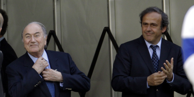 FIFA President Sepp Blatter, left, and UEFA President Michel Platini attend an exhibition soccer match to promote the Special Olympics for people with intellectual disabilities, in Cape Town South Africa, Saturday, July 3, 2010. (AP Photo/Gero Breloer)