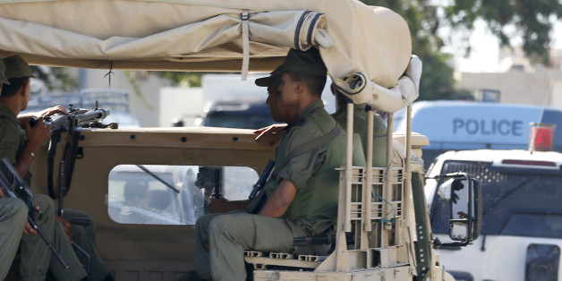 Tunisian army patrol near the attacked Imperial Marhaba hotel in Sousse, Tunisia, Saturday, June 27, 2015. The morning after a lone gunman killed dozens of people at a beach resort in Tunisia, busloads of tourists are heading to the nearby Enfidha-Hammamet airport hoping to return to their home countries. (AP Photo/Darko Vojinovic)
