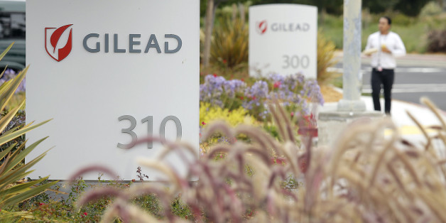 FILE - In this July 9, 2015 file photo, a man walks outside the headquarters of Gilead Sciences in Foster City, Calif. Gilead Sciences reports quarterly financial results on Tuesday, July 28, 2015. (AP Photo/Eric Risberg, File)