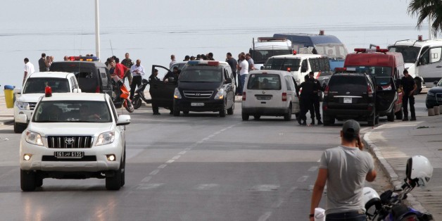 Tunisian police officers secure the place where a suicide bomber blew himself up near a seaside hotel in Sousse,Tunisia, Wednesday, Oct. 30, 2013. The attack was believed to be the country's first suicide bombing. Witnesses told Tunisian media that the suicide bomber appeared to be about to enter the Riadh Palm hotel in Sousse, about 90 miles (150 kilometers) south of the capital, Tunis, when there was an explosion. The Interior Ministry said that no one else was injured and no property was dama