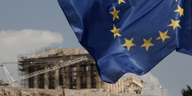 A European Union (EU) flag flutters in front of the temple of the Parthenon in Athens, Greece, Saturday, Aug. 15, 2015. Finance ministers of the 19-nation euro single currency group on Friday approved the first 26 billion euros ($29 billion) of a vast new bailout package to help rebuild Greece's shattered economy. (AP Photo/Yorgos Karahalis)