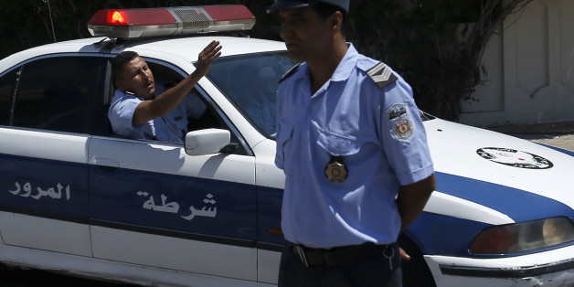 Tunisian police officers guard a convoy of top security officials from Britain, France, Germany and Belgium in Sousse, Tunisia, Monday, June 29, 2015. British Home Secretary Theresa May, French Interior Minister Bernard Cazeneuve, German Interior Minister Thomas de Maiziere and Belgian Interior Minister Jan Jambon joined their Tunisian counterpart on the beach in front of the Imperial Marhaba hotel in the Mediterranean resort of Sousse for a tribute Monday. (AP Photo/Darko Vojinovic)