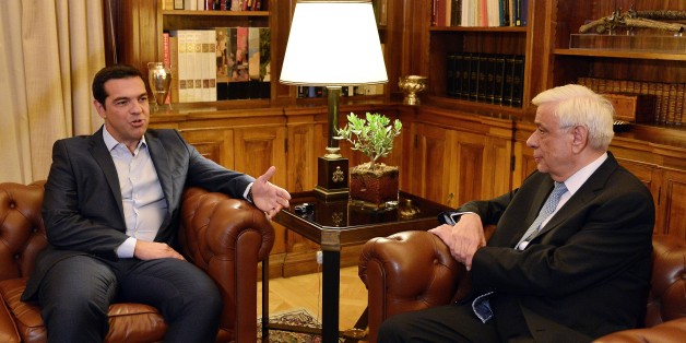 Greek Prime Minister Alexis Tsipras (L) talks to the President of the Greek Republic Prokopis Pavlopoulos at the Presidental Palace in Athens on August 20, 2015. Greek Prime Minister Alexis Tsipras announced his resignation and called for snap elections on August 20, as he went on the offensive to defend the country's massive bailout after it triggered a rebellion within his own party. AFP PHOTO / LOUISA GOULIAMAKI (Photo credit should read LOUISA GOULIAMAKI/AFP/Getty Images)