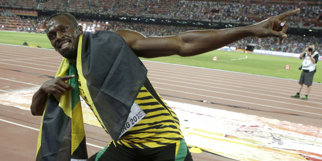 Jamaica's Usain Bolt celebrates after winning the gold medal in the men's 100m ahead of United States' at the World Athletics Championships at the Bird's Nest stadium in Beijing, Sunday, Aug. 23, 2015. (AP Photo/Lee Jin-man)