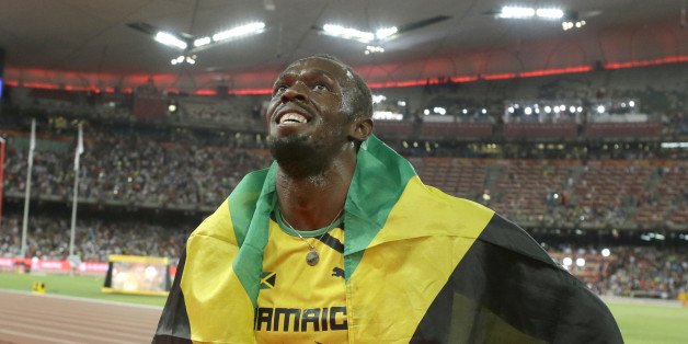 Jamaica's Usain Bolt celebrates after winning the gold medal in the men's 100m ahead of United States' at the World Athletics Championships at the Bird's Nest stadium in Beijing, Sunday, Aug. 23, 2015. (AP Photo/Lee Jin-man)