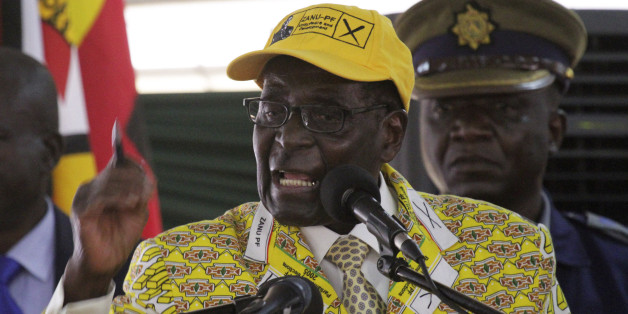 Zimbabwean President Robert Mugabe delivers his speech during the official opening of the Zanu pf 6th National Congress in Harare, Thursday, Dec. 4, 2014. Mugabe attacked his deputy President Joice Mujuru aledging she plotted to remove him from power.(AP Photo/Tsvangirayi Mukwazhi)