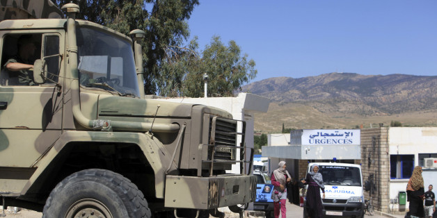 A military truck parks outside the hospital of Kasserine, near the Algerian border, Thursday, July 17, 2014. Militants in western Tunisia staged two simultaneous attacks on army posts while soldiers held a Ramadan feast, killing at least 14 soldiers, authorities said Thursday. (AP Photo/ Mouldi Kraeim)