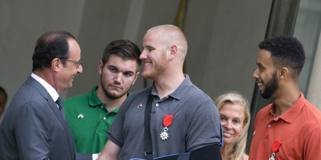 (LtoR) French President Francois Hollande shakes hands with off-duty US serviceman Spencer Stone (C), next to off-duty serviceman Alek Skarlatos and Anthony Sadler (R) and US ambassador to France Jane Hartley after a reception at the Elysee Palace in Paris on August 24, 2015, during which they have been awarded with France's top Legion d'Honneur medal in recognition of their bravery after they overpowered the train attacker. AFP PHOTO / KENZO TRIBOUILLARD (Photo credit should read KENZO TRIBOUILLARD/AFP/Getty Images)