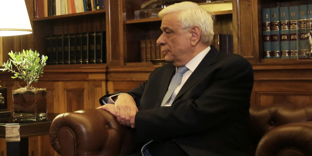 Greek Prime Minister Alexis Tsipras , left, speaks with Greek President Prokopis Pavlopoulos, during their meeting in Athens, Thursday, Aug. 20, 2015. Tsipras announced his governmentâs resignation and called early elections Thursday, seeking to consolidate his mandate to implement a new three-year international bailout that sparked a rebellion within his radical left Syriza party. (AP Photo/Petros Giannakouris)