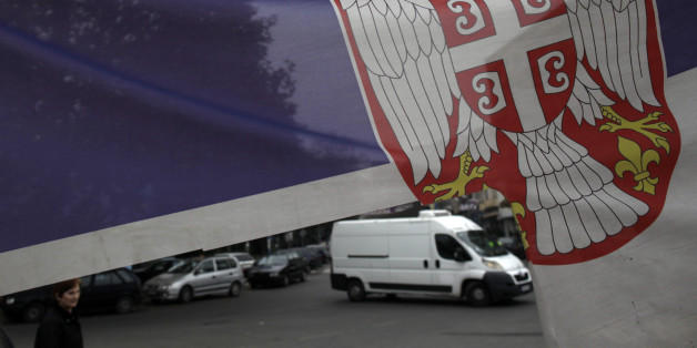 The Serbian flags flies over the barricade in front of the main bridge, one of two bridges between the southern, ethnic Albanian-dominated and the northern, Serb-dominated part of Mitrovica, Kosovo Saturday, Nov 2, 2013. Kosovo local elections are scheduled for November 3. As part of attempts to normalize its relations with Kosovo, Serbia has agreed to convince Kosovo Serbs to end their boycott of ethnic Albanian dominated institutions in protest over Kosovo's 2008 secession from Serbia. Serbia