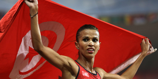Tunisia's Habiba Ghribi celebrates after finishing second in the womenâs 3000m steeplechase final at the World Athletics Championships at the Bird's Nest stadium in Beijing, Wednesday, Aug. 26, 2015. (AP Photo/David J. Phillip)