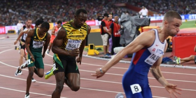 Le Jamaïcain Usain Bolt (c) en demi-finales du 200 m aux Mondiaux à Pékin, le 26 août 2015