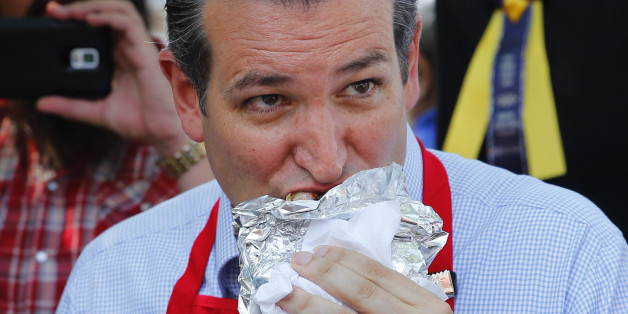 Republican presidential candidate, Sen. Ted Cruz, R-Texas, eats a pork chop at the Iowa State Fair, Friday, Aug. 21, 2015, in Des Moines, Iowa. (AP Photo/Paul Sancya)