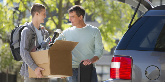 USA, New Jersey, Jersey City, Father helping teenage son (16-17) packing to college