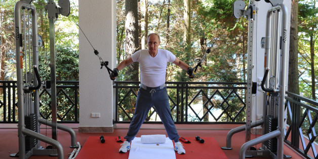 Russian President Vladimir Putin exercises during his meeting with Prime Minister Dmitry Medvedev, unseen, at the Black Sea resort of Sochi, Russia, Sunday, Aug. 30, 2015. (AP Photo/RIA Novosti, Mikhail Klimentyev, Presidential Press Service)