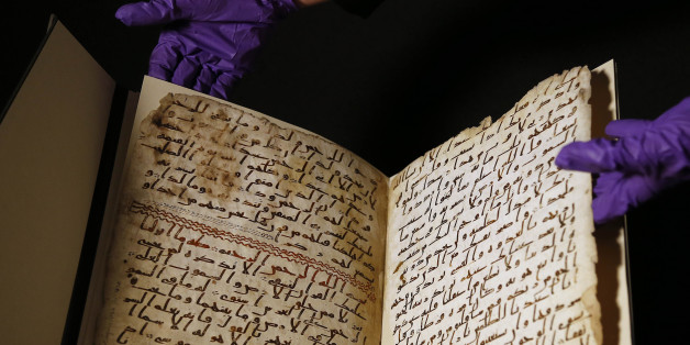 A university assistant shows fragments of an old Quran at the University in Birmingham, in Birmingham central England Wednesday, July 22, 2015. The University of Birmingham said Wednesday that scientific tests prove a Quran manuscript in its collection is one of the oldest known and may have been written close to the time of the Prophet Muhammad. Radiocarbon testing at Oxford University dated the parchment to the time of the prophet, who is generally believed to have lived between 570 and 632.(AP Photo/Frank Augstein)