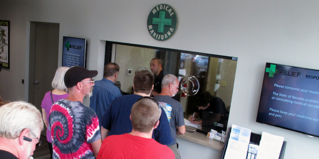 Dana Metz, 64, of Sparks, Nev., was at the head of the line at the window to be among the first in Nevada on Friday July 31, 2015, to legally purchase medical marijuana at the Silver State Relief dispensary in Sparks, Nev. Nevadans voted to legalize medical marijuana in 2000, but no language was in place to establish a system to sell or distribute it until 2013. (AP Photo/Scott Sonner)