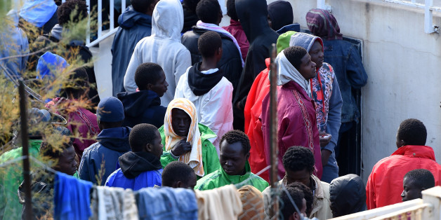 LAMPEDUSA, ITALY - FEBRUARY 18: Migrants are seen in the Temporary Permanence Centre (CPT) on February 18, 2015 in Lampedusa, Italy. Hundreds of migrants have recently arrived in Lampedusa fleeing the attacks by ISIS in Libya. The Temporary Permanence Centre' (CPT) of Lampedusa, which was designed to accommodate 250, currently holds about 1,200 migrants following Sunday's rescue of 2,000 in the Mediterranean Sea between the island of Lampedusa and the Libyan coast (Photo by Tullio M. Puglia/Ge