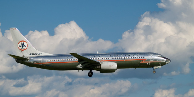 Vintage colors on this American Airlines 737, lining up to land at the Montréal airport. The green on the underside of the plane is the reflection of the grass that was just below it. I'd recommend watching this picture a bit <a href="http://www.flickr.com/photo_zoom.gne?id=196731203&size=l">bigger</a>. Picture was slightly cropped.Check other pictures of this plane on <a href="http://www.airliners.net/search/photo.search?regsearch=N951AA" rel="nofollow">www.airliners.net/search/photo.search