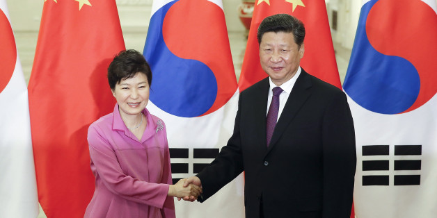 Chinese President Xi Jinping, right, shakes hands with South Korean President Park Geun-hye at the Great Hall of the People in Beijing, Wednesday, Sept. 2, 2015. World leaders are in Beijing to attend events related to China's commemoration of the 70th anniversary of the end of World War II. (Lintao Zhang/Pool Photo via AP)