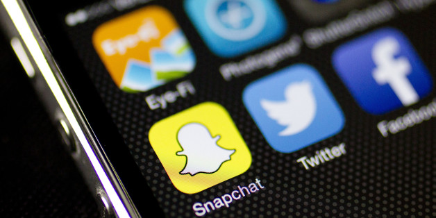 The Snapchat Inc. application (app) is seen on an on an Apple Inc. iPhone 5s displayed for a photograph in Washington, D.C., U.S., on Wednesday, Feb. 18, 2015. Snapchat Inc. is raising money that could value the company at as much as $19 billion. Photographer: Andrew Harrer/Bloomberg via Getty Images