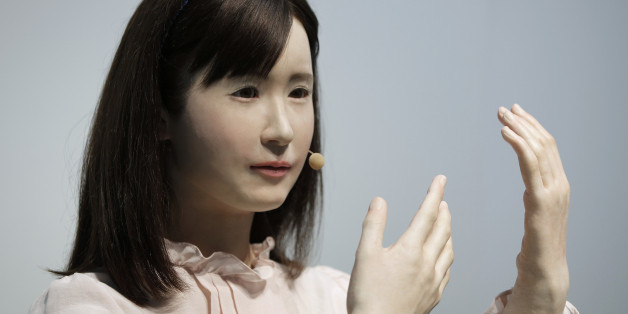 Communication android 'Aiko Chihira', developed by Toshiba Corp., performs sign language during a demonstration at the Cutting-Edge IT & Electronics Comprehensive Exhibition (CEATEC) in Chiba, Japan, on Tuesday, Oct. 7, 2014. CEATEC will run until Oct. 11. Photographer: Kiyoshi Ota/Bloomberg via Getty Images