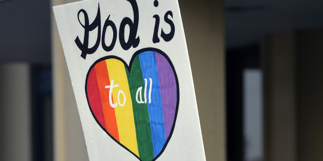 Anthony Carroill of Flat Woods, Ky., waits for the arrival of Rowan County Clerk Kim Davis at the Carl D. Perkins Federal building in Ashland, Ky., Thursday, Sept. 3, 2015. Davis and her deputy clerks have been summoned to a hearing Thursday before Judge David Bunning to explain why she is refusing to issue marriage licenses despite a federal order to do so. (AP Photo/Timothy D. Easley)