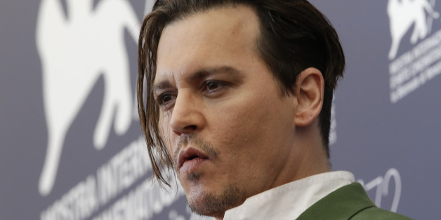 Actor Johnny Deep poses during the photo call for the movie Black Mass at the 72nd edition of the Venice Film Festival in Venice, Italy, Friday, Sept. 4, 2015. (AP Photo/Andrew Medichini)