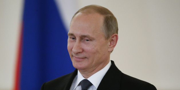 FILE - In this May 28, 2015 file-pool photo,Russian President Vladimir Putin attends a ceremony in the Kremlin in Moscow, Russia. When President Barack Obama and other world leaders gather in Germany next week, Russiaâs Vladimir Putin will be left off the guest list, part of his punishment for more than a year of alleged aggression in Ukraine. (Sergei Karpukhin/File-Pool Photo via AP)