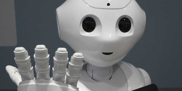 FILE - In this June 6, 2014 file photo, humanoid robot Pepper is on display at SoftBank mobile shop in Tokyo. Japanese mobile carrier Softbank said Tuesday, Feb. 10, 2015 it will incorporate artificial intelligence technology from IBM into its empathetic robot Pepper that goes on sale in Japan this month. (AP Photo/Koji Sasahara, File)