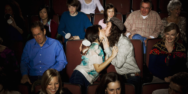 Kissing couple disturbing audience in movie theater