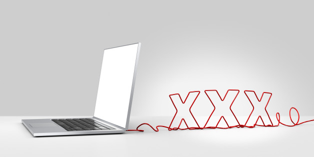 Laptop computer with a red ethernet cable forming 'XXX', coming out of the back on a plain background