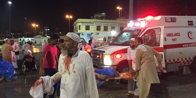 MECCA, SAUDI ARABIA - SEPTEMBER 11: Paramedics and officals hospitalize wounded people after a construction crane collapsed over the Muslim pilgrims around the Muslims' holy place Kaaba in Mecca, Saudi Arabia on September 11, 2015. Crane crash, believed collapsed by strong winds, killed at least 52 people and left many others wounded. Kaaba and surrounded area were under construction due to expansion reasons. (Photo by Ozkan Bilgin/Anadolu Agency/Getty Images)