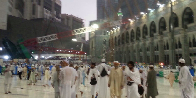 Wounded pilgrims sit on the floor after a crane collapse that killed dozens inside the Grand Mosque in Mecca, Saudi Arabia, Friday, Sept. 11, 2015. The accident happened as pilgrims from around the world converged on the city, Islam's holiest site, for the annual Hajj pilgrimage, which takes place this month. (AP Photo)