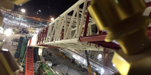 A towering construction crane is seen collapsed over the Grand Mosque, in Mecca, Saudi Arabia, early Saturday morning, Sept. 12, 2015. The towering construction crane toppled over on Friday during a violent rainstorm in the Saudi city of Mecca, Islam's holiest site, crashing into the Grand Mosque and killing over a hundred people, ahead of the start of the annual hajj pilgrimage later this month. (AP Photo)