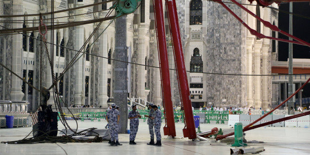 Civil Defense personnel inspect the damage at the Grand Mosque after a crane collapsed, in Mecca, Saudi Arabia, early Saturday morning, Sept. 12, 2015. The towering construction crane toppled over on Friday during a violent rainstorm in the Saudi city of Mecca, Islam's holiest site, crashing into the Grand Mosque, ahead of the start of the annual hajj pilgrimage later this month. (AP Photo)