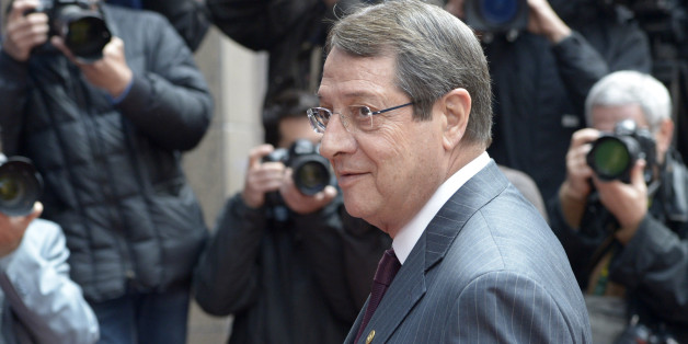 Cypriot President Nikos Anastasiadis arrives at an EU summit in Brussels on Wednesday, May 22, 2013. Leaders from the 27 European Union countries gather in Brussels for one of their regular European Council sessions. On the agenda is the increasingly controversial subject of tax evasion. Countries such as Austria and Luxembourg which have lucrative, and somewhat opaque, banking systems have begun to fight back against efforts to improve the transparency of the EU's financial system. (AP Photo/Ezequiel Scagnetti)