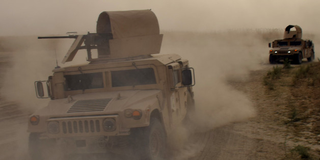 In this Saturday, Sept, 12, 2015 photo, Iraqi army Humvees arrive to support security forces and Sunni and Shiite volunteers during heavy clashes with Islamic State group militants at the front line in the suburbs of Ramadi, Anbar province, Iraq. (AP Photo)