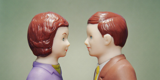 Husband and wife figurines facing each other